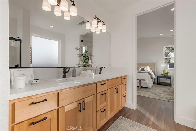 bathroom featuring vanity and wood-type flooring