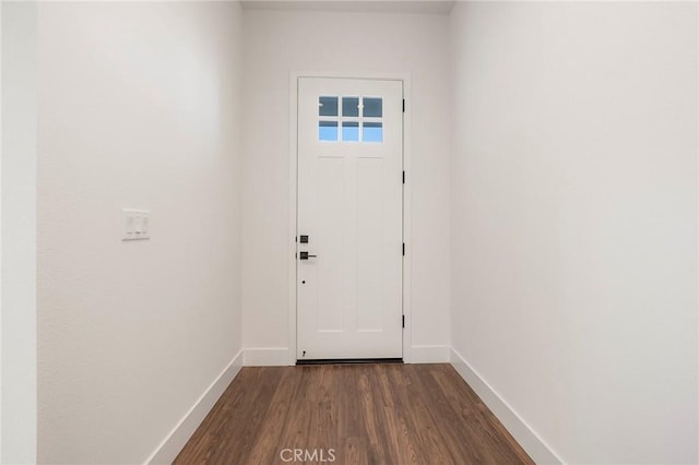 doorway to outside with dark wood-type flooring