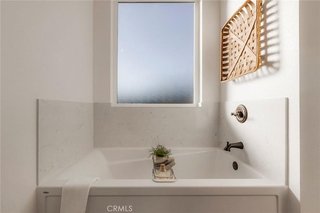 bathroom featuring a tub to relax in