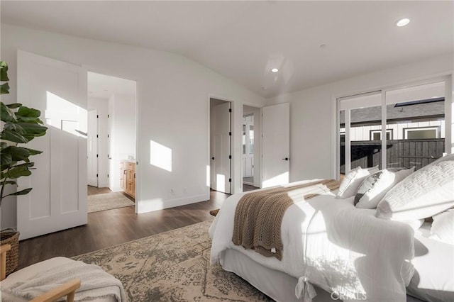 bedroom featuring lofted ceiling and dark hardwood / wood-style flooring