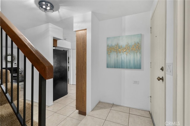 hallway featuring light tile patterned floors