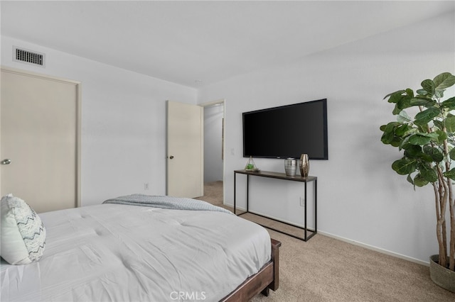 bedroom featuring light colored carpet