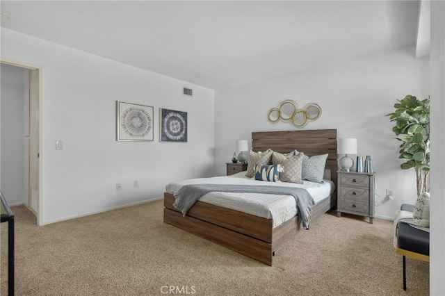 bedroom featuring light carpet