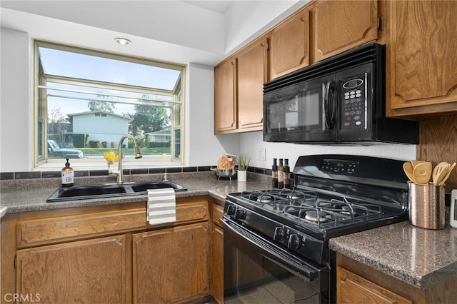 kitchen with sink and black appliances