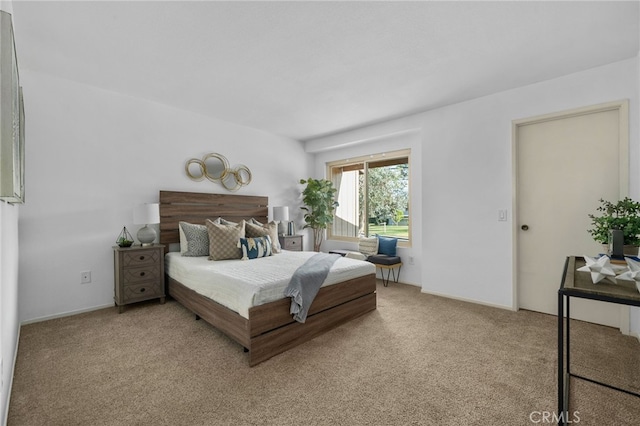 bedroom with light carpet