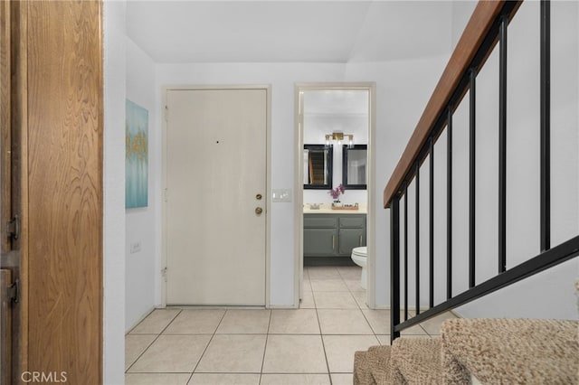 foyer featuring light tile patterned flooring