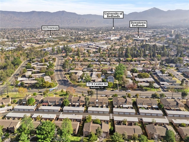 birds eye view of property featuring a mountain view