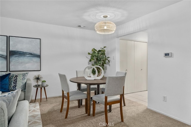 view of carpeted dining area