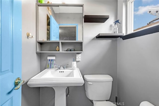 bathroom with sink and toilet