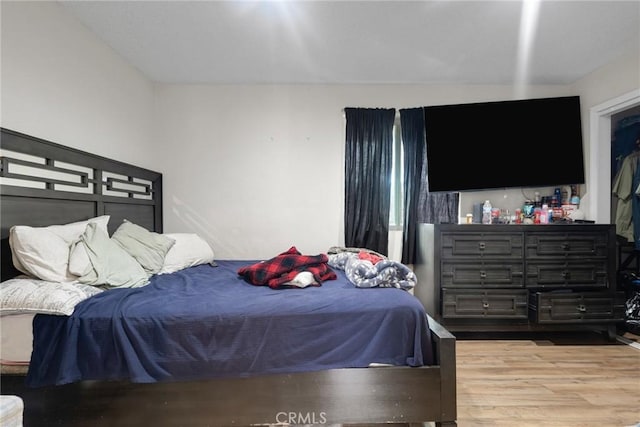 bedroom featuring hardwood / wood-style flooring