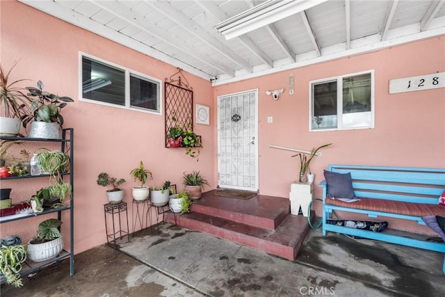 doorway to property featuring a patio area