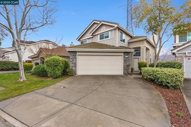 view of front facade with a garage and a front lawn