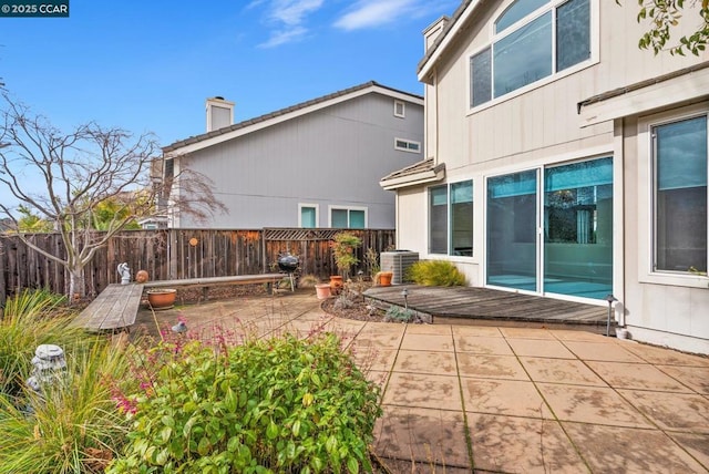 back of house with central AC unit and a patio area