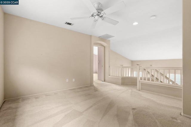 additional living space with vaulted ceiling, carpet floors, and ceiling fan