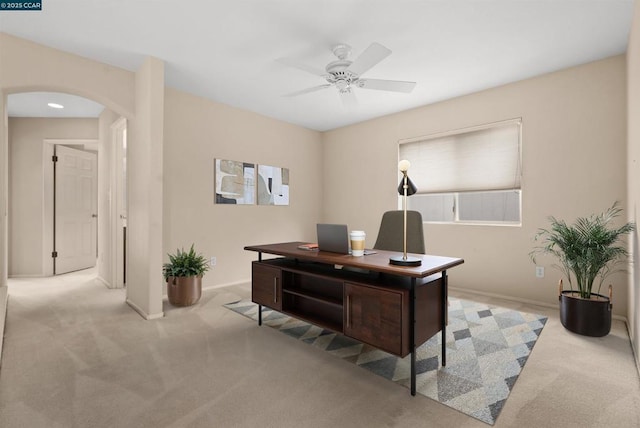 home office featuring light colored carpet and ceiling fan