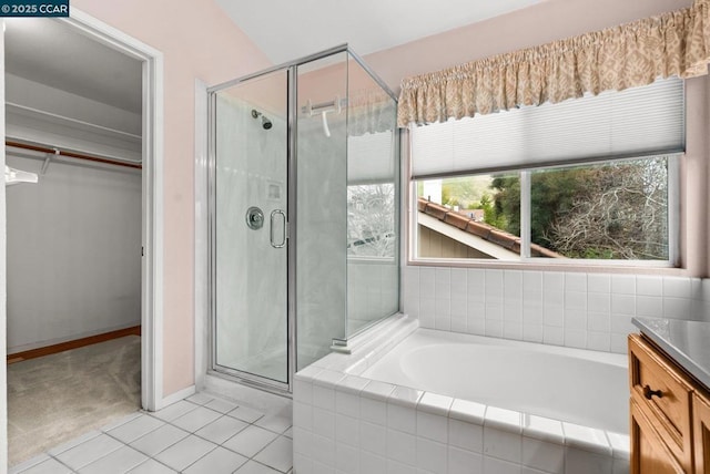 bathroom featuring vanity, separate shower and tub, and tile patterned flooring