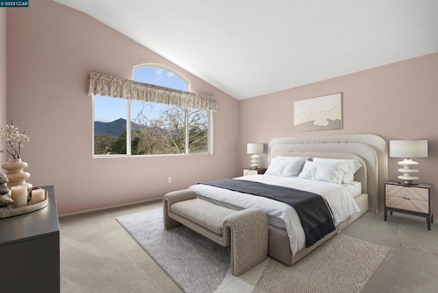 carpeted bedroom with lofted ceiling and a mountain view