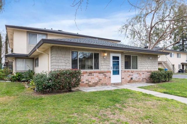 view of front of home with a front yard