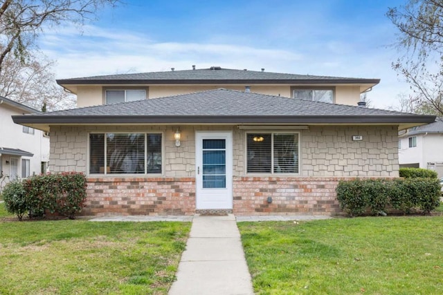 view of front of home with a front lawn