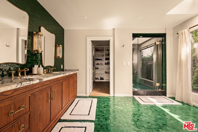 bathroom featuring vanity and backsplash