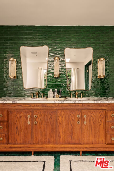 bathroom with vanity and backsplash