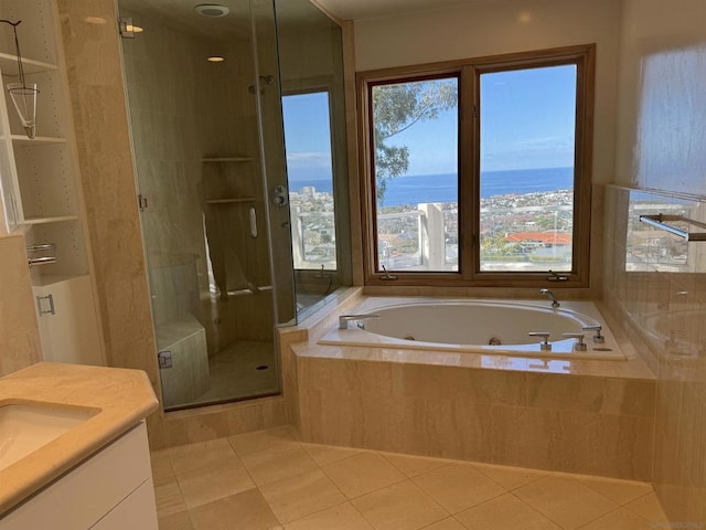 bathroom featuring a water view, vanity, plus walk in shower, and tile patterned flooring