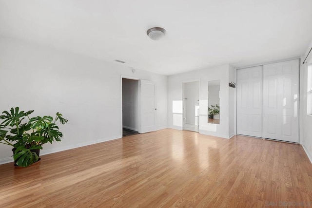 unfurnished room with light hardwood / wood-style flooring