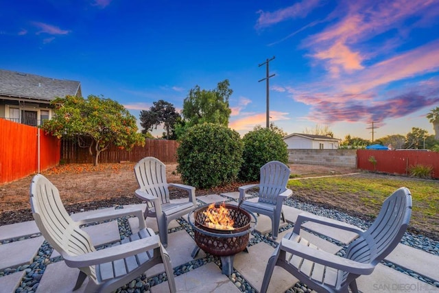 patio terrace at dusk with a fire pit