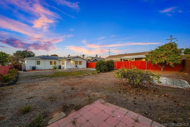 yard at dusk with a patio