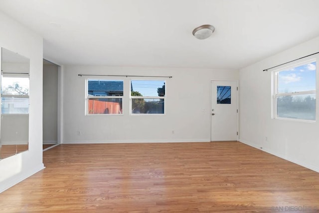 empty room with light wood-type flooring