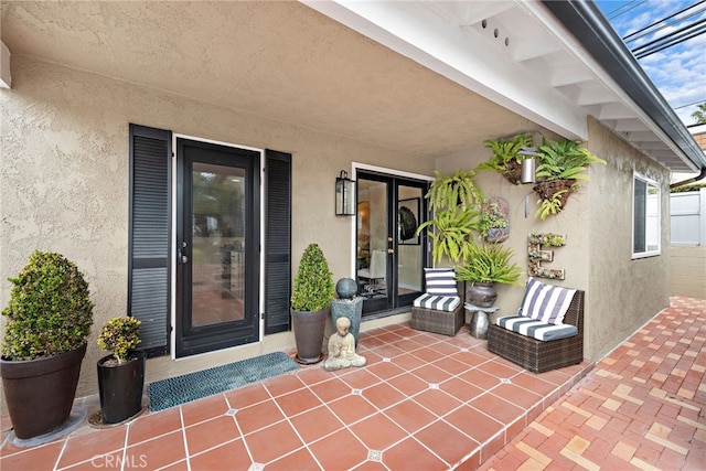 doorway to property with a patio area