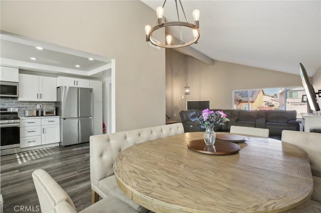 dining room featuring vaulted ceiling, dark hardwood / wood-style floors, and a notable chandelier