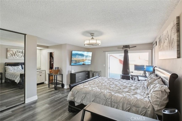 bedroom with wood-type flooring and a textured ceiling