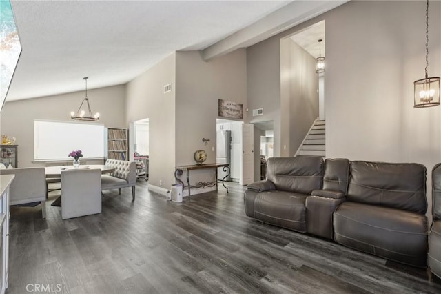 living room with dark hardwood / wood-style floors, a notable chandelier, and high vaulted ceiling