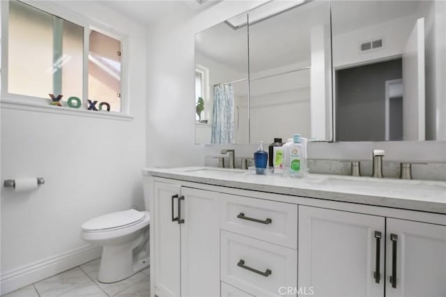 bathroom with vanity, a shower with curtain, and toilet