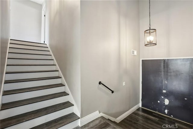 stairs featuring hardwood / wood-style flooring