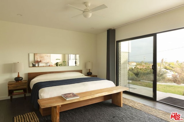 bedroom featuring dark hardwood / wood-style flooring, access to outside, and ceiling fan