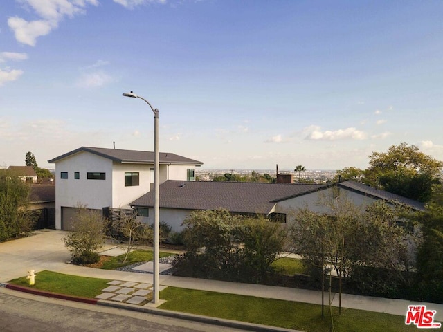 view of side of property with a garage