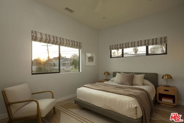 bedroom featuring wood-type flooring