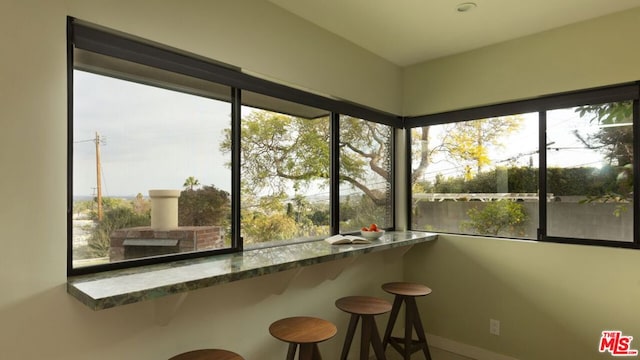 unfurnished sunroom with a healthy amount of sunlight