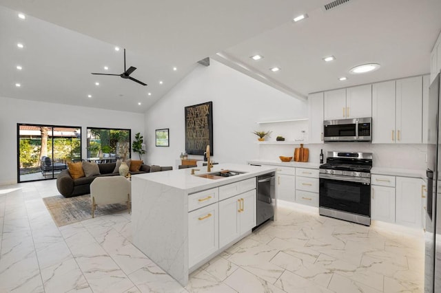 kitchen featuring white cabinetry, stainless steel appliances, and sink