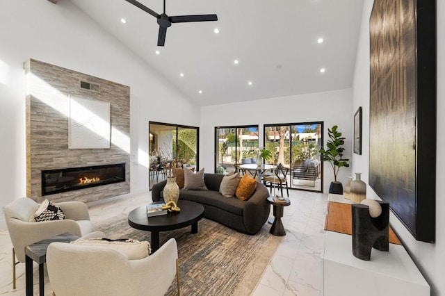 living room with ceiling fan and high vaulted ceiling