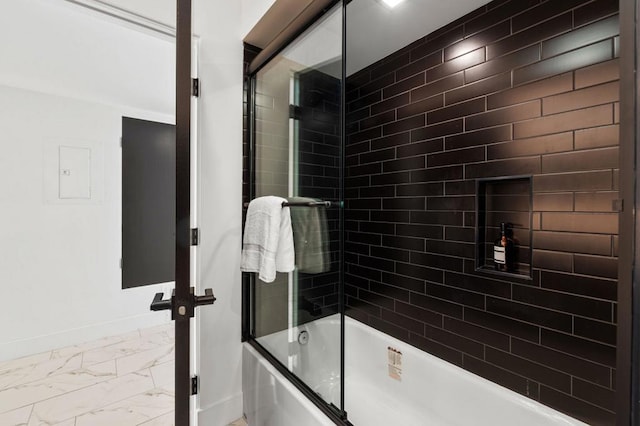 bathroom with shower / bath combination with glass door