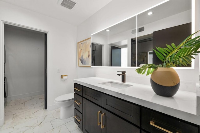 bathroom with vanity and toilet