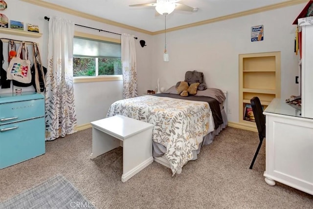 carpeted bedroom with ceiling fan and ornamental molding