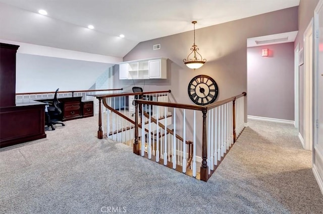 hall with light carpet and lofted ceiling