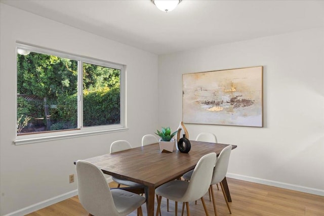 dining area featuring light wood-type flooring