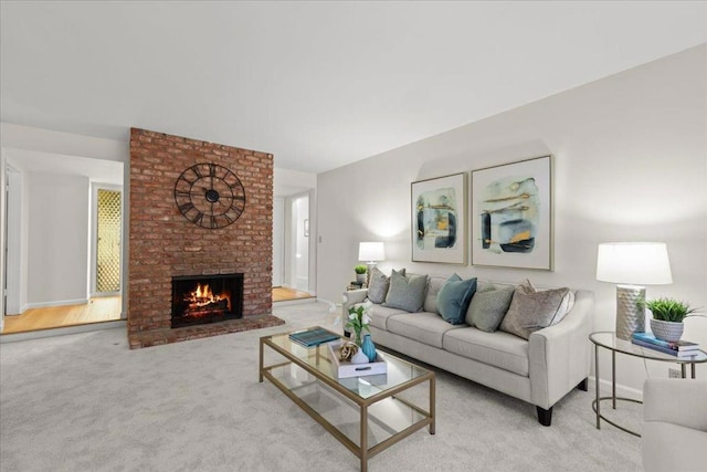 living room with a brick fireplace and light carpet