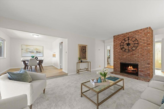 living room with light carpet and a brick fireplace