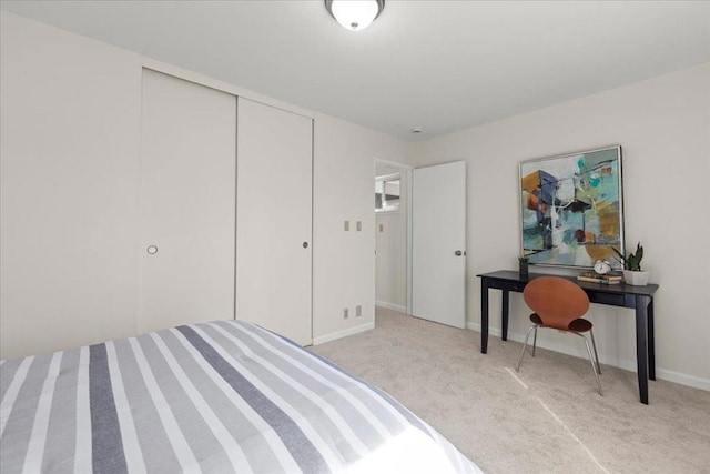 carpeted bedroom featuring a closet